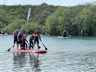 Paddleboarding with friends Action Watersports